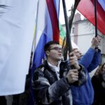 20.03.2016 Kielce. Procesja młodzieży z palmami i flagami państw przeszła z kościoła akademickiego do katedry upamiętniając ustanowienie przez Jana Pawła II Światowych Dni Młodzieży. / Jarosław Kubalski / Radio Kielce