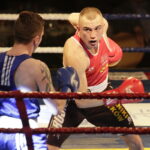 09.12.2016 Chęciny. IV Międzynarodowy Memoriał Bokserski im. Leszka Drogosza. Walka Adrian Kowal KKB Rush (czerwony) - Thomas Casey Irlandia. / Jarosław Kubalski / Radio Kielce