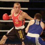 09.12.2016 Chęciny. IV Międzynarodowy Memoriał Bokserski im. Leszka Drogosza. Walka Adrian Kowal KKB Rush (czerwony) - Thomas Casey Irlandia. / Jarosław Kubalski / Radio Kielce