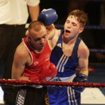 09.12.2016 Chęciny. IV Międzynarodowy Memoriał Bokserski im. Leszka Drogosza. Walka Adrian Kowal KKB Rush (czerwony) - Thomas Casey Irlandia. / Jarosław Kubalski / Radio Kielce