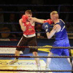 09.12.2016 Chęciny. IV Międzynarodowy Memoriał Bokserski im. Leszka Drogosza. Walka Tomasz Karyś KKB Rush (czerwony) - Jason Scully Irlandia. / Jarosław Kubalski / Radio Kielce