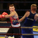 09.12.2016 Chęciny. IV Międzynarodowy Memoriał Bokserski im. Leszka Drogosza. Walka Tomasz Karyś KKB Rush (czerwony) - Jason Scully Irlandia. / Jarosław Kubalski / Radio Kielce