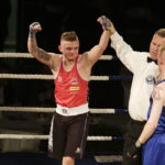 09.12.2016 Chęciny. IV Międzynarodowy Memoriał Bokserski im. Leszka Drogosza. Walka Tomasz Karyś KKB Rush (czerwony) - Jason Scully Irlandia. / Jarosław Kubalski / Radio Kielce