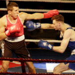 09.12.2016 Chęciny. IV Międzynarodowy Memoriał Bokserski im. Leszka Drogosza. Walka Bartosz Gołębiewski KKB Rush (czerwony) - Michael Nevin Irlandia. / Jarosław Kubalski / Radio Kielce