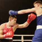 09.12.2016 Chęciny. IV Międzynarodowy Memoriał Bokserski im. Leszka Drogosza. Walka Bartosz Gołębiewski KKB Rush (czerwony) - Michael Nevin Irlandia. / Jarosław Kubalski / Radio Kielce