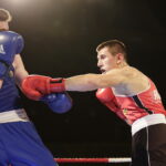 09.12.2016 Chęciny. IV Międzynarodowy Memoriał Bokserski im. Leszka Drogosza. Walka Bartosz Gołębiewski KKB Rush (czerwony) - Michael Nevin Irlandia. / Jarosław Kubalski / Radio Kielce