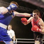 09.12.2016 Chęciny. IV Międzynarodowy Memoriał Bokserski im. Leszka Drogosza. Walka Bartosz Gołębiewski KKB Rush (czerwony) - Michael Nevin Irlandia. / Jarosław Kubalski / Radio Kielce
