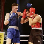 09.12.2016 Chęciny. IV Międzynarodowy Memoriał Bokserski im. Leszka Drogosza. Walka Bartosz Gołębiewski KKB Rush (czerwony) - Michael Nevin Irlandia. / Jarosław Kubalski / Radio Kielce