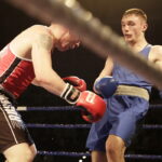 09.12.2016 Chęciny. IV Międzynarodowy Memoriał Bokserski im. Leszka Drogosza. Walka Sebastian Rembecki KKB Rush (czerwony) - Tony Browne Irlandia. / Jarosław Kubalski / Radio Kielce