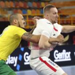 19.01.2021 Egipt. Mistrzostwa świata w piłce ręcznej. Mecz Brazylia - Polska. Na zdjęciu (od lewej): Rogerio Moraes i Rafał Przybylski / Khaled Elfiqi / POOL / PAP/EPA