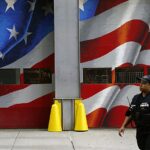 epaselect epa09459650 A police officer passes FDNY Engine Company 10 and Ladder Company 10 across from the World Trade Center Complex in New York, USA, 10 September 2021. The 20th anniversary of the worst terrorist attack on US soil will be observed on 11 September 2021.  EPA/WILL OLIVER