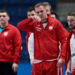 20.01.2022. Bratysława, Słowacja. Mistrzostwa Europy piłkarzy ręcznych. Faza zasadnicza. Mecz grupy II: Polska - Norwegia. Na zdjęciu (w środku): Rafał Przybylski, obok: Michał Daszek / PAP/Adam Warżawa