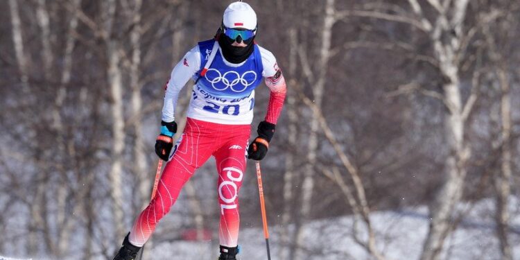 18.02.2022. Chiny. Zimowe Igrzyska Olimpijskie Pekin 2022. Na zdjęciu: Monika Hojnisz-Starega podczas biegu w biathlonie kobiet na 12,5 km / PAP/EPA/MARTIN DIVISEK