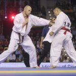 25.09.2022. Kielce. Finałowe walki VII Mistrzostw Świata Karate w Kategoriach Wagowych. Na zdjęciu: Nariyoshi Tada - Japonia, Juras Sokolovas - Litwa / Fot. Wiktor Taszłow - Radio Kielce