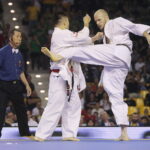 25.09.2022. Kielce. Finałowe walki VII Mistrzostw Świata Karate w Kategoriach Wagowych. Na zdjęciu: Nariyoshi Tada - Japonia, Juras Sokolovas - Litwa / Fot. Wiktor Taszłow - Radio Kielce