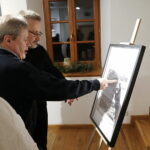 08.01.2025. Kielce. Wernisaż wystawy fotografii Mariusza Uciga " Kielce na starej i nowej fotografii" / Fot. Wiktor Taszłow - Radio Kielce